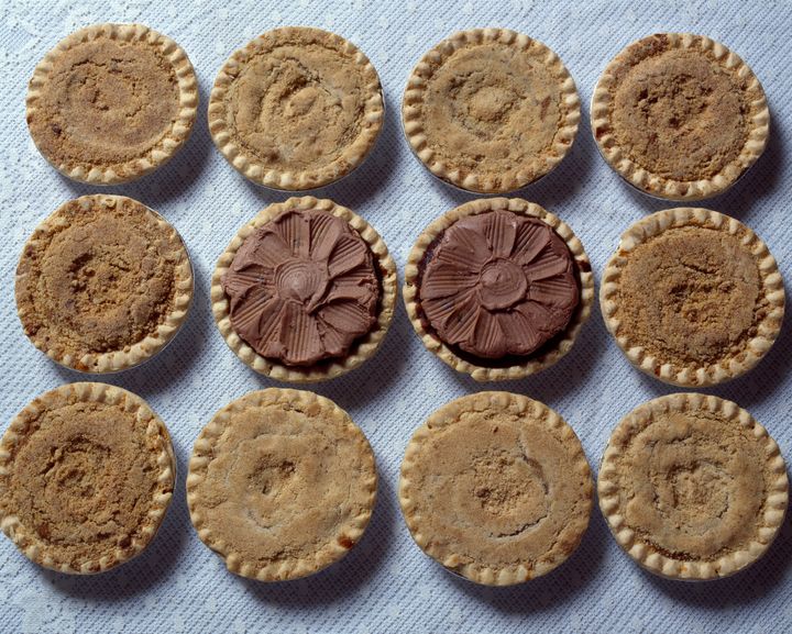 Modern versions of shoofly pie might include a final chocolate layer on the top, as seen in the center pies here from Lancaster, Pennsylvania.