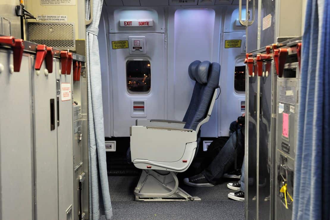 Sitting within five rows of an emergency exit improves your chances of surviving a "survivable" crash, says research.