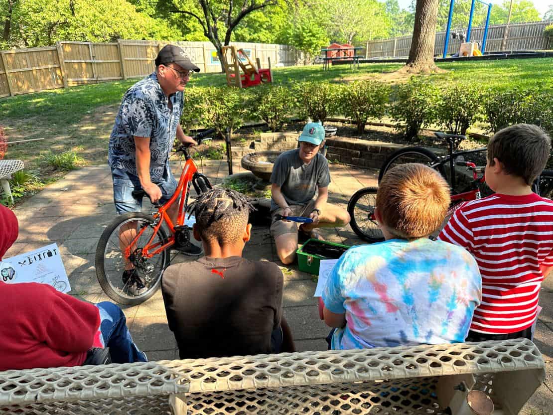 At a Newhouse KC summer camp, volunteers teach children how to ride and maintain bikes. Newhouse KC accepts men, women, children and pets, according to Endres, a special consultant to the shelter.